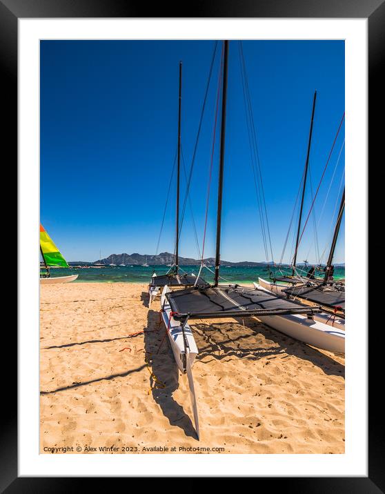 View of catamaran sailing boat at coast of sand be Framed Mounted Print by Alex Winter