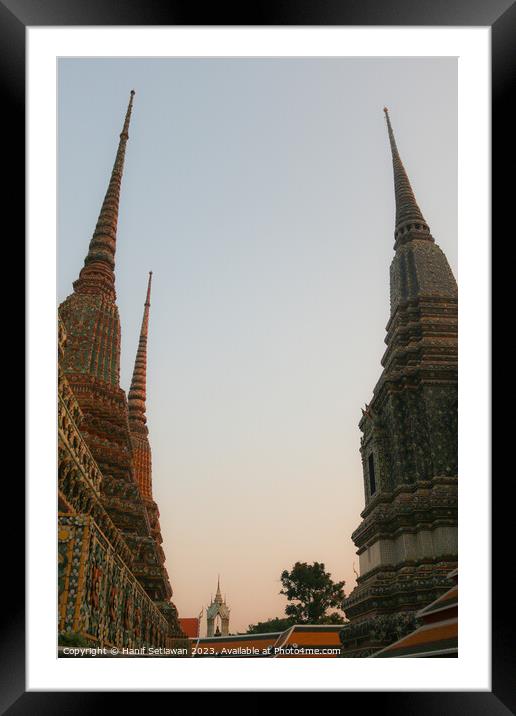 Second view of two stupa against sky at Wat Pho Framed Mounted Print by Hanif Setiawan