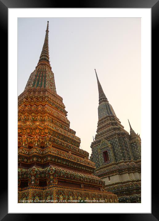 Third view of two stupa against sky at Wat Pho Framed Mounted Print by Hanif Setiawan