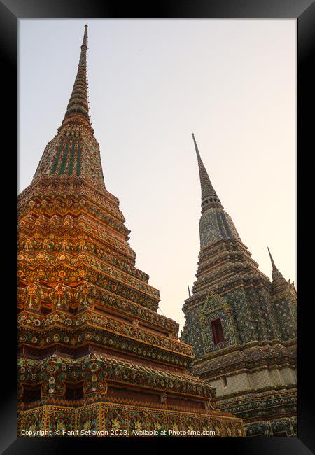 Third view of two stupa against sky at Wat Pho Framed Print by Hanif Setiawan