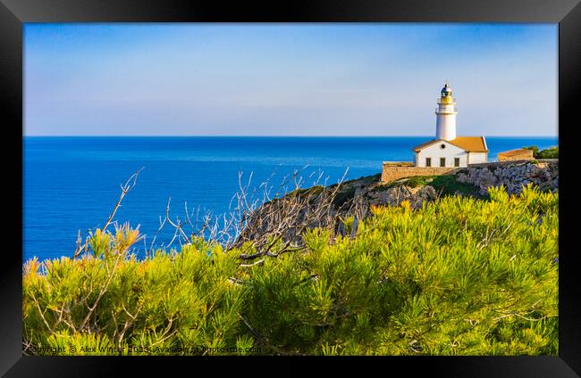 Lighthouse at the cape in Cala Rajada Framed Print by Alex Winter