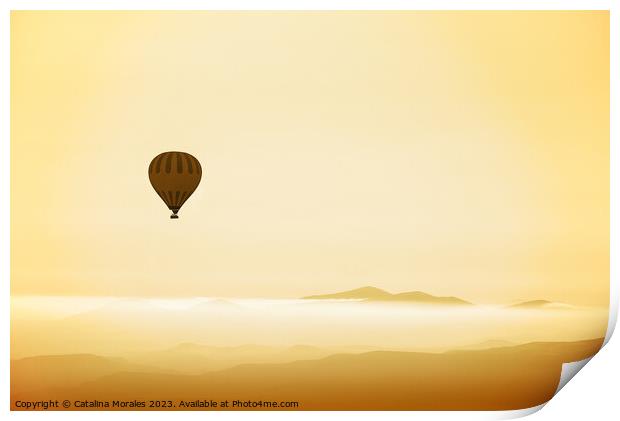 Hot air balloon over mountains in dawn mist Print by Catalina Morales