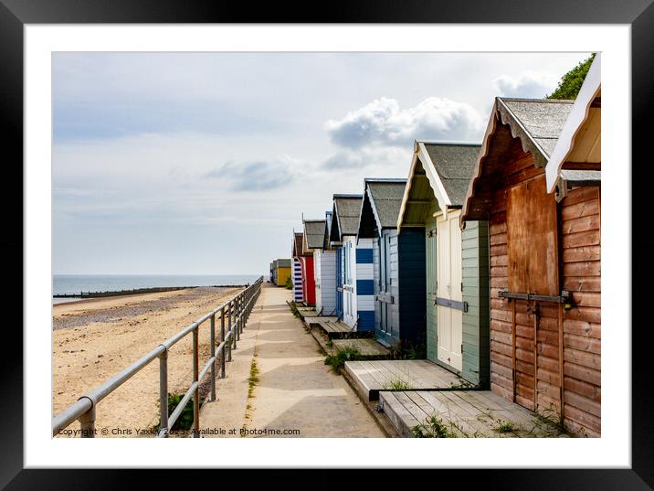 Wooden beach huts Framed Mounted Print by Chris Yaxley