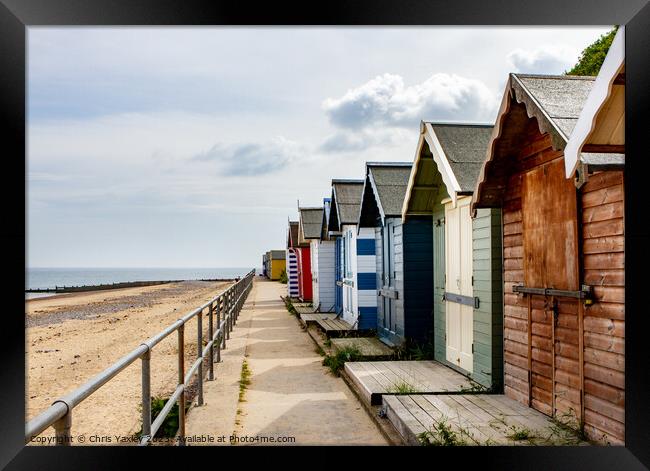 Wooden beach huts Framed Print by Chris Yaxley