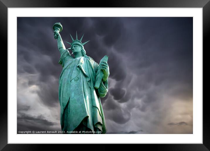 Statue of Liberty in a stormy background Framed Mounted Print by Laurent Renault