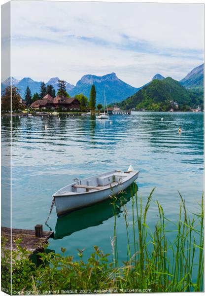 Wooden boat on the lake of Annecy Canvas Print by Laurent Renault