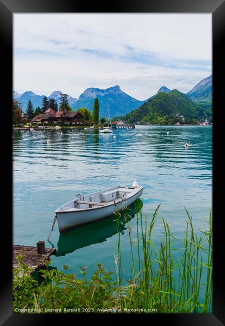 Wooden boat on the lake of Annecy Framed Print by Laurent Renault