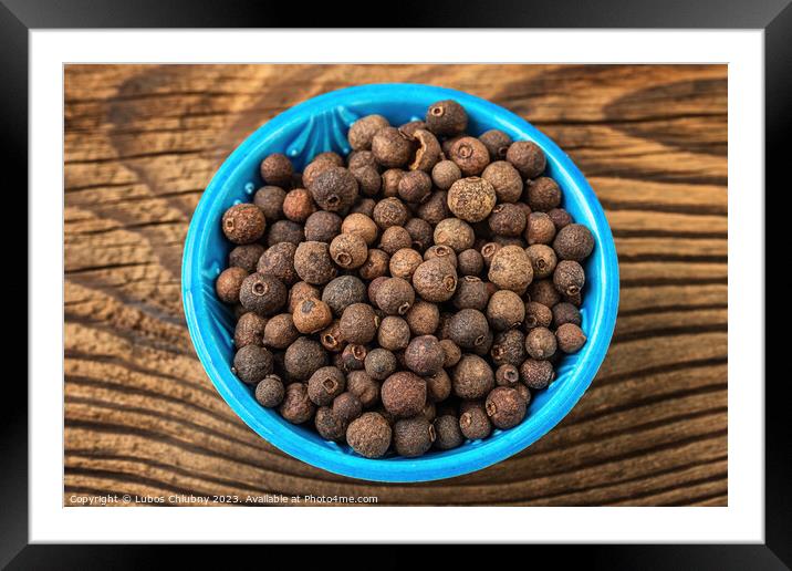 Allspice spice in a small bowl on the table Framed Mounted Print by Lubos Chlubny