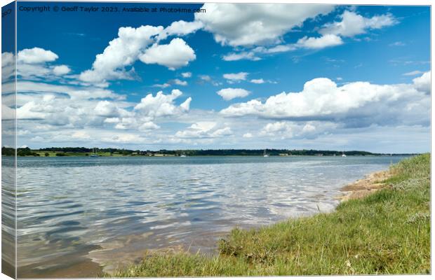 Blue sky over the river Canvas Print by Geoff Taylor