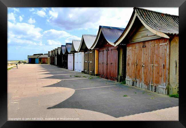 Beach hut shadows. Framed Print by john hill