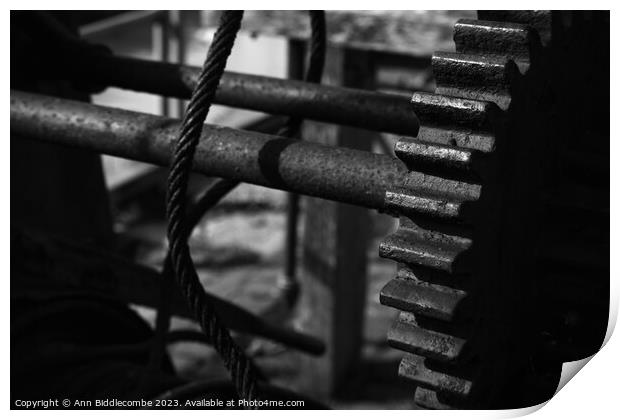 Old gears on a winch Print by Ann Biddlecombe
