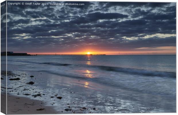 Sunrise with moody clouds Canvas Print by Geoff Taylor