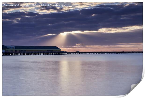 Rays over the pier Print by Geoff Taylor