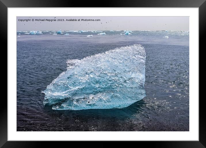 Diamond Beach in Iceland with blue icebergs melting on black san Framed Mounted Print by Michael Piepgras