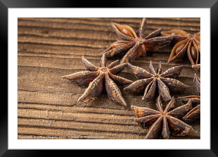 Dried star anise spice on vintage wooden board Framed Mounted Print by Lubos Chlubny