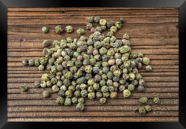 Dried spices green pepper on a wooden board Framed Print by Lubos Chlubny