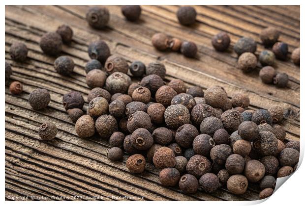 Allspice spice on wooden table Print by Lubos Chlubny