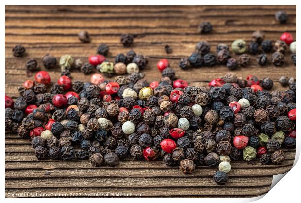 Peppercorns on dark rustic wooden background. Mix of different peppers Print by Lubos Chlubny