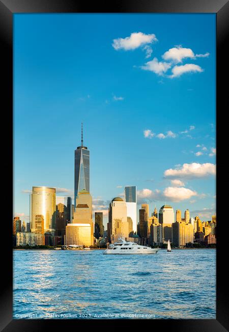 Lower Manhattan skyline over the Hudson, New York  Framed Print by Justin Foulkes