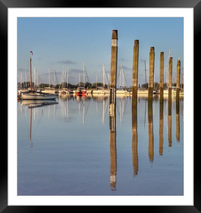 Mooring posts at the Brightlingsea hard.  Framed Mounted Print by Tony lopez