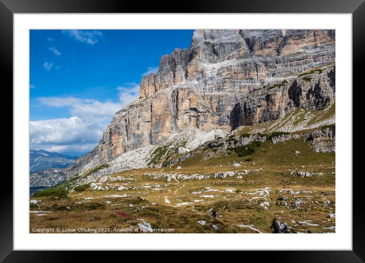Male mountain climber on a Via Ferrata in breathtaking landscape of Dolomites Mountains in Italy. Travel adventure concept. Framed Mounted Print by Lubos Chlubny