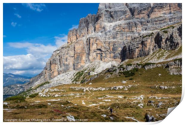 Male mountain climber on a Via Ferrata in breathtaking landscape of Dolomites Mountains in Italy. Travel adventure concept. Print by Lubos Chlubny