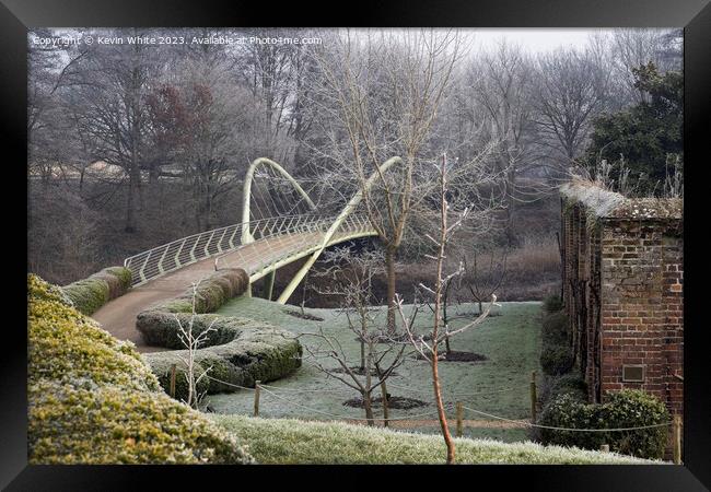 Painshill Park bridge across river past the walled garden Framed Print by Kevin White