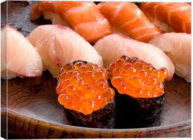Close up of sushi salmon fish eggs with yellow tail and salmon p Canvas Print by Thomas Baker