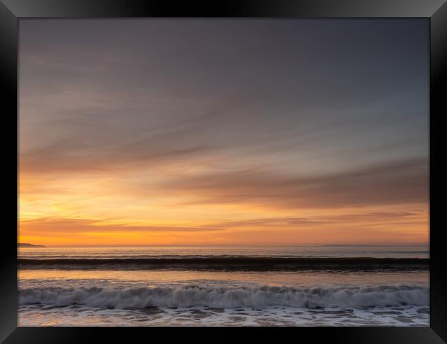 Wave watching at sunset Framed Print by Tony Twyman