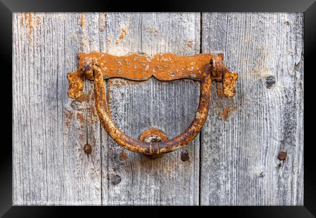 Old door knocker on a wooden door Framed Print by MallorcaScape Images