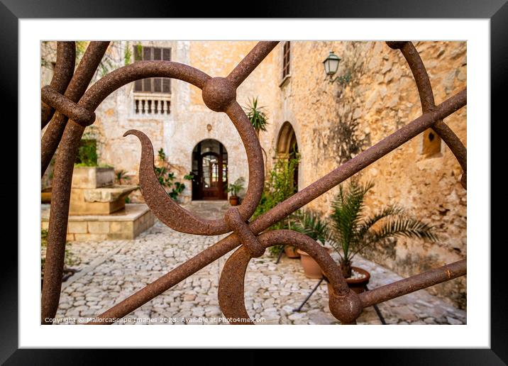 Ornamental iron gate with view into a mediterranea Framed Mounted Print by MallorcaScape Images
