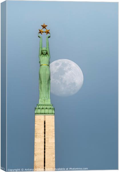 Riga Freedom Monument at Moonrise Canvas Print by Antony McAulay