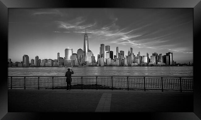 Man takes a photo of Manhattan skyline - travel photography Framed Print by Erik Lattwein