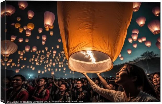 Asian tourists throwing paper lanterns into the air on a festiva Canvas Print by Joaquin Corbalan