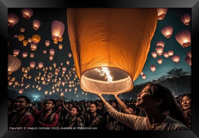 Asian tourists throwing paper lanterns into the air on a festiva Framed Print by Joaquin Corbalan