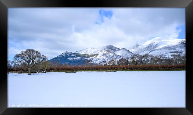 Snow covered field and hills Framed Print by Darrell Evans