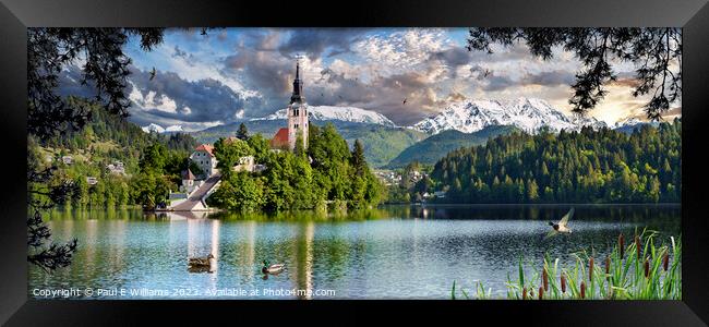 The Picturesque Island Church in Lake Bled with Alpine peaks beh Framed Print by Paul E Williams