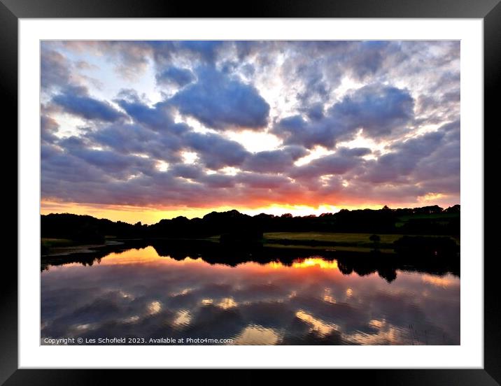 Sunset and lake reflection  Framed Mounted Print by Les Schofield