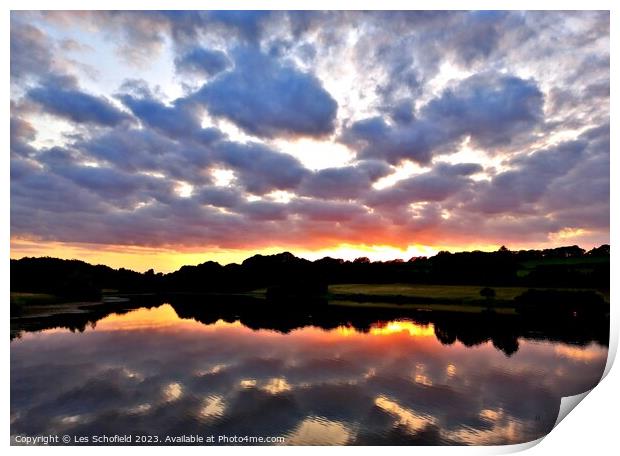 Sunset and lake reflection  Print by Les Schofield