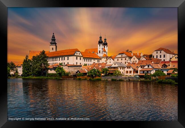 View of Telc across pond with reflections, South Moravia, Czech Republic. Framed Print by Sergey Fedoskin