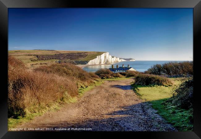 View of Seven Sisters Chalk Cliffs and Coastguard Cottages at Cuckmere Haven Sussex Framed Print by John Gilham