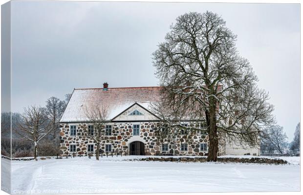 Hovdala Castle Main Building in Winter Canvas Print by Antony McAulay