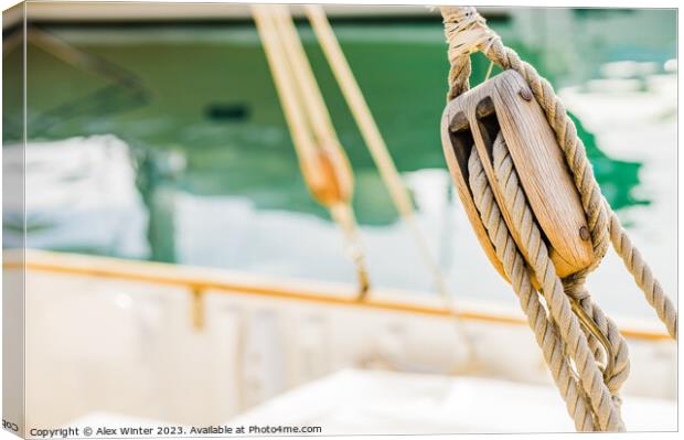 Rustic Charm of a Wooden Sailboat Pulley Canvas Print by Alex Winter
