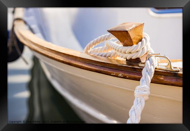 White mooring rope is knotted on boat cleat Framed Print by Alex Winter