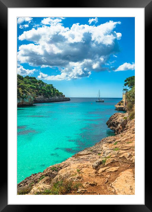 Idyllic bay with boat at coast Cala Santanyi Framed Mounted Print by Alex Winter