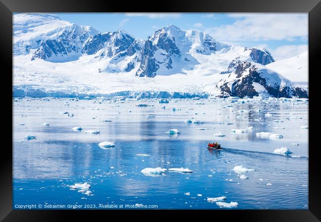 Zodiac going out to explore Antarctica Framed Print by Sebastien Greber