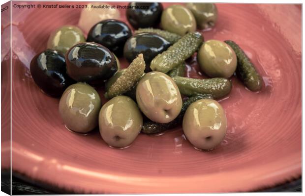 Close-up shot of mix of black and green olives with pickle in an orange bowl. Canvas Print by Kristof Bellens