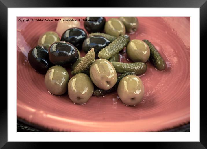 Close-up shot of mix of black and green olives with pickle in an orange bowl. Framed Mounted Print by Kristof Bellens