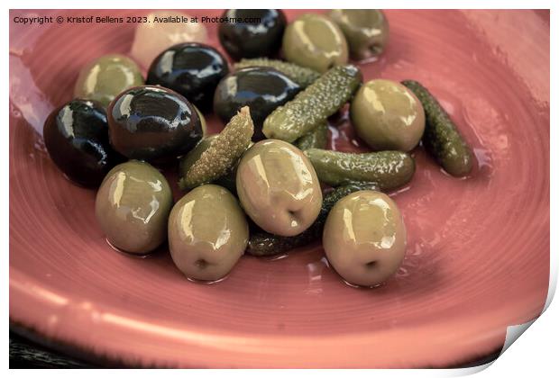 Close-up shot of mix of black and green olives with pickle in an orange bowl. Print by Kristof Bellens