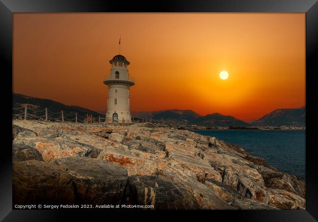 Lighthouse at sunset. Framed Print by Sergey Fedoskin